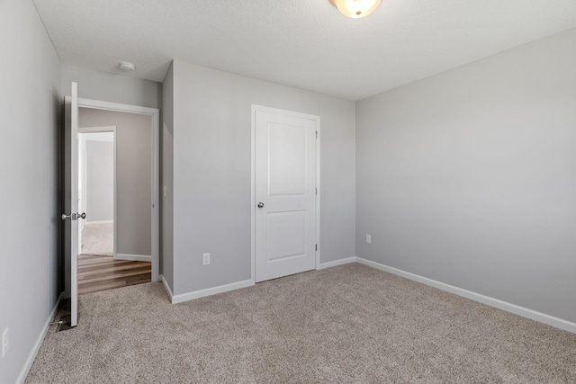 1020 2nd St NW, Delano, MN 55328 - unfurnished bedroom with carpet flooring and baseboards