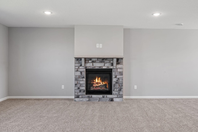 1020 2nd St NW, Delano, MN 55328 - detailed view of carpet floors, a glass covered fireplace, baseboards, and recessed lighting