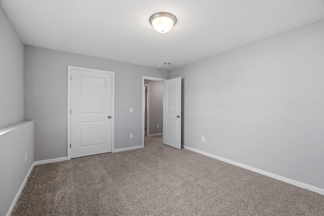1020 2nd St NW, Delano, MN 55328 - unfurnished bedroom featuring carpet flooring and baseboards