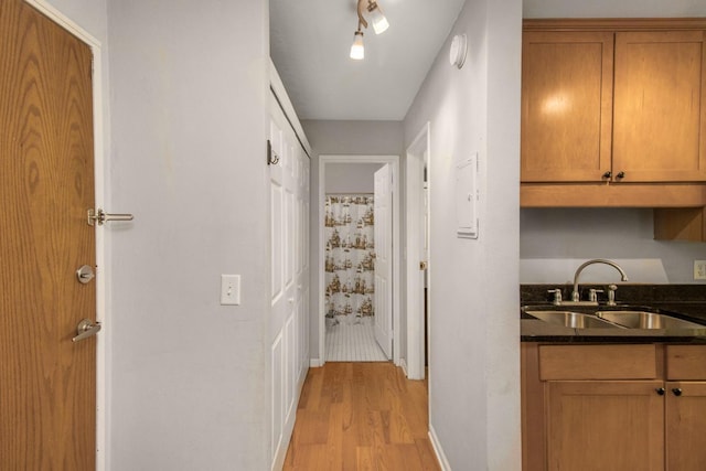 3018 Aldrich Ave S Unit 12, Minneapolis, MN 55408 - hall featuring a sink and light wood-style flooring