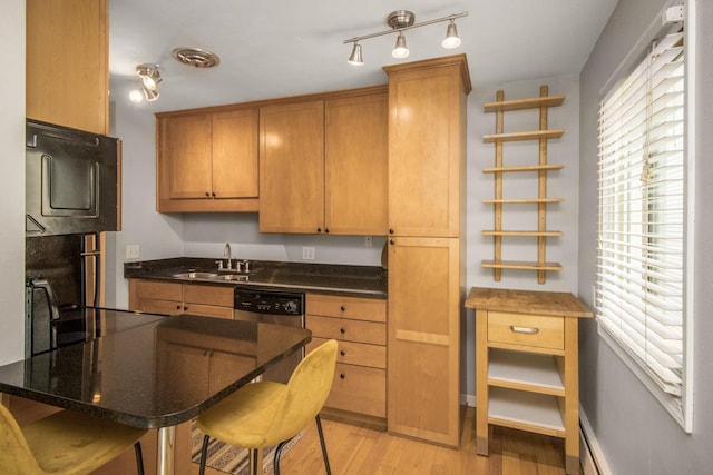 3018 Aldrich Ave S Unit 12, Minneapolis, MN 55408 - kitchen with a sink, dishwasher, open shelves, light wood finished floors, and a kitchen bar