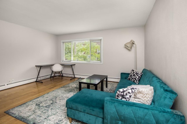 3018 Aldrich Ave S Unit 12, Minneapolis, MN 55408 - sitting room featuring wood finished floors and a baseboard heating unit