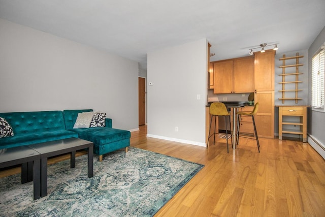 3018 Aldrich Ave S Unit 12, Minneapolis, MN 55408 - living room featuring light wood-style floors and baseboards
