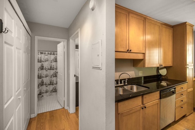 3018 Aldrich Ave S Unit 12, Minneapolis, MN 55408 - kitchen with dishwasher, a sink, light wood-style floors, and brown cabinetry