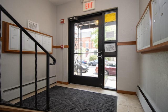 3018 Aldrich Ave S Unit 12, Minneapolis, MN 55408 - entryway with light tile patterned flooring, baseboard heating, stairway, and baseboards