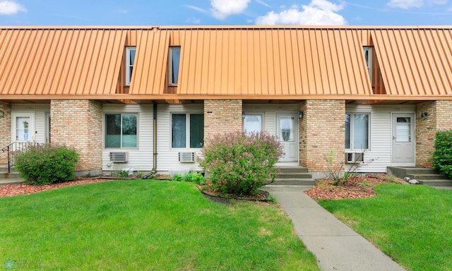 309 12 1/2 Ave E, West Fargo, ND 58078 - view of property featuring a front lawn and brick siding