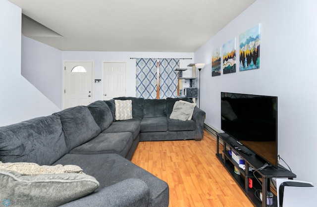 309 12 1/2 Ave E, West Fargo, ND 58078 - living area featuring light wood-style floors and a baseboard radiator