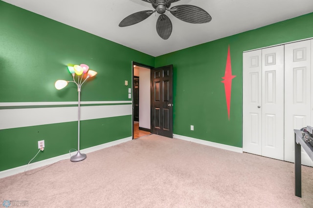 309 12 1/2 Ave E, West Fargo, ND 58078 - unfurnished bedroom with carpet flooring, a closet, baseboards, and ceiling fan