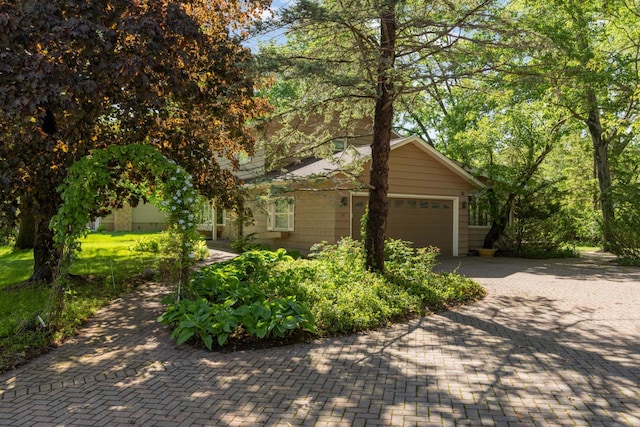 15423 Boulder Creek Dr, Minnetonka, MN 55345 - view of front facade with an attached garage and decorative driveway