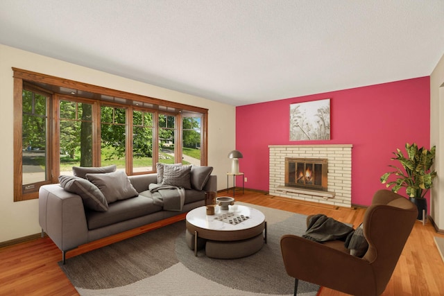 15423 Boulder Creek Dr, Minnetonka, MN 55345 - living room with healthy amount of natural light, wood finished floors, and a fireplace