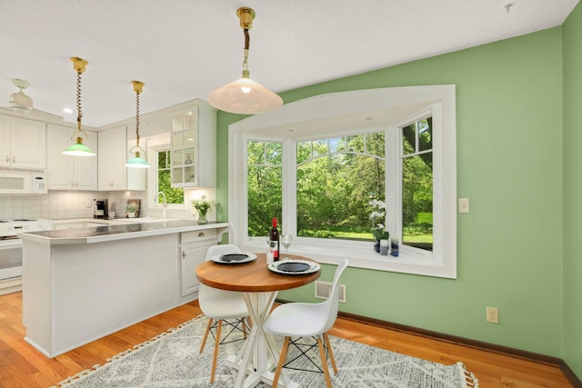 15423 Boulder Creek Dr, Minnetonka, MN 55345 - dining space with baseboards and light wood-style floors