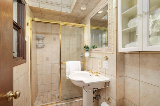 15423 Boulder Creek Dr, Minnetonka, MN 55345 - bathroom with a shower stall, tile walls, and recessed lighting