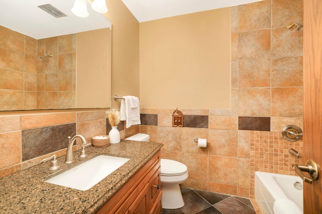 15423 Boulder Creek Dr, Minnetonka, MN 55345 - bathroom featuring tile walls, vanity, toilet, and shower / washtub combination