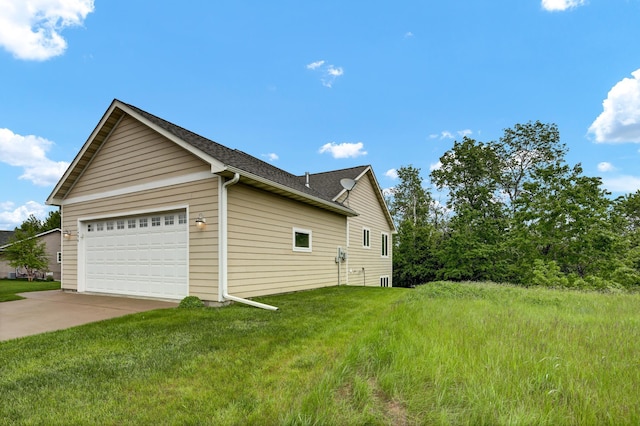 1426 Woodland Way, Lake City, MN 55041 - view of side of home with concrete driveway, a garage, a yard, and a shingled roof