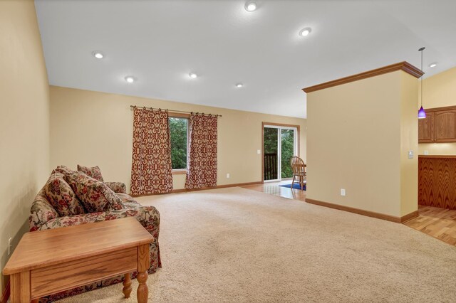 1426 Woodland Way, Lake City, MN 55041 - living area with light carpet, healthy amount of natural light, vaulted ceiling, baseboards, and recessed lighting