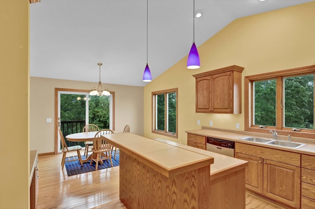 1426 Woodland Way, Lake City, MN 55041 - kitchen with a sink, dishwashing machine, light wood-style flooring, light countertops, and high vaulted ceiling