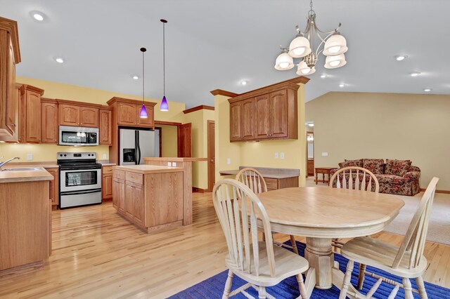 1426 Woodland Way, Lake City, MN 55041 - dining area with light wood finished floors, a chandelier, recessed lighting, and vaulted ceiling