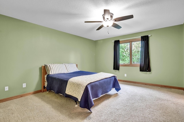 1426 Woodland Way, Lake City, MN 55041 - carpeted bedroom with baseboards, a ceiling fan, and a textured ceiling