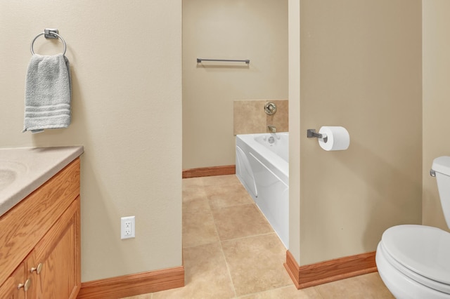 1426 Woodland Way, Lake City, MN 55041 - bathroom with toilet, baseboards, a garden tub, tile patterned flooring, and vanity