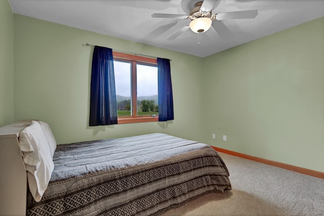 1426 Woodland Way, Lake City, MN 55041 - bedroom with carpet floors, baseboards, and a ceiling fan