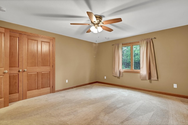 1426 Woodland Way, Lake City, MN 55041 - unfurnished bedroom with carpet, baseboards, and ceiling fan