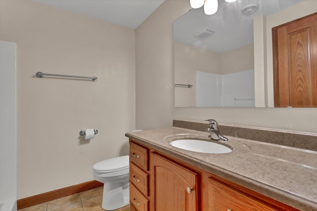 1426 Woodland Way, Lake City, MN 55041 - full bath with vanity, tile patterned floors, toilet, baseboards, and a shower