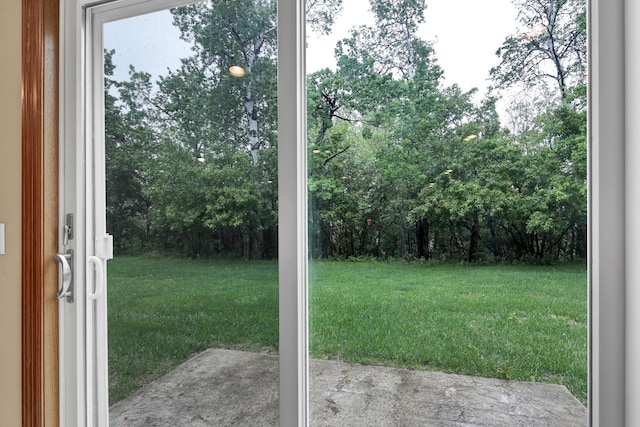 1426 Woodland Way, Lake City, MN 55041 - view of grassy yard with a patio and view of wooded area