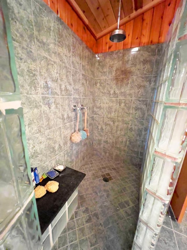 X Waters Island, Morse Twp, MN 55731 - bathroom with a tile shower, vaulted ceiling, and wood ceiling