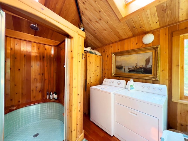 X Waters Island, Morse Twp, MN 55731 - laundry area featuring washing machine and clothes dryer, a skylight, wood walls, and wood finished floors