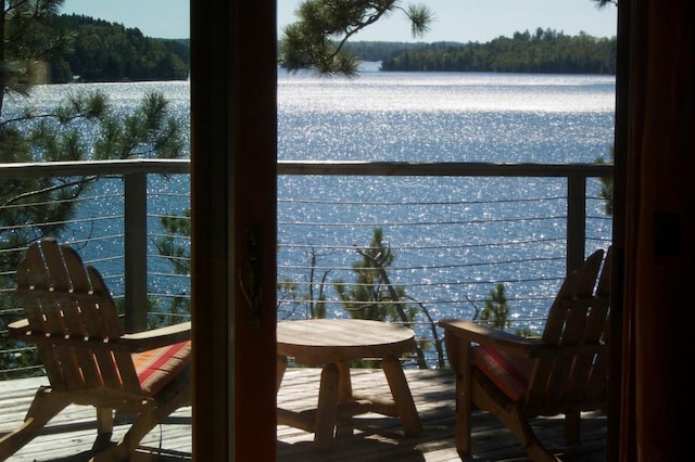 X Waters Island, Morse Twp, MN 55731 - balcony featuring a water view and a forest view
