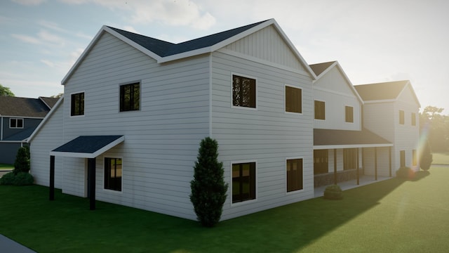 5223 Harvest Square Ln NW, Rochester, MN 55901 - view of side of home featuring board and batten siding and a yard