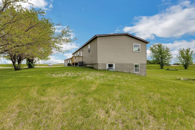 19363 County Road 21, Eden Lake Twp, MN 56368 - view of side of home featuring a lawn and central air condition unit