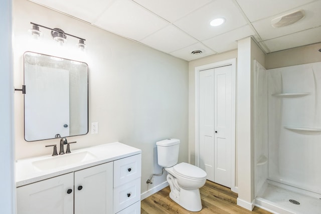 19363 County Road 21, Eden Lake Twp, MN 56368 - bathroom with wood finished floors, vanity, walk in shower, toilet, and a closet
