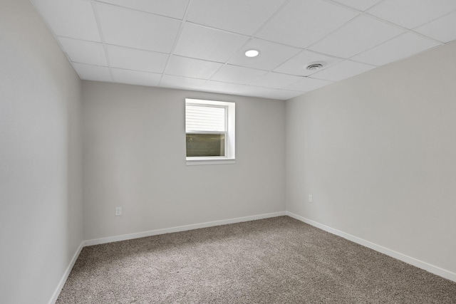 19363 County Road 21, Eden Lake Twp, MN 56368 - unfurnished room featuring a drop ceiling, carpet floors, and baseboards