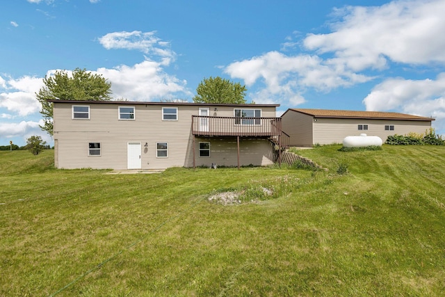 19363 County Road 21, Eden Lake Twp, MN 56368 - rear view of house with a deck and a lawn
