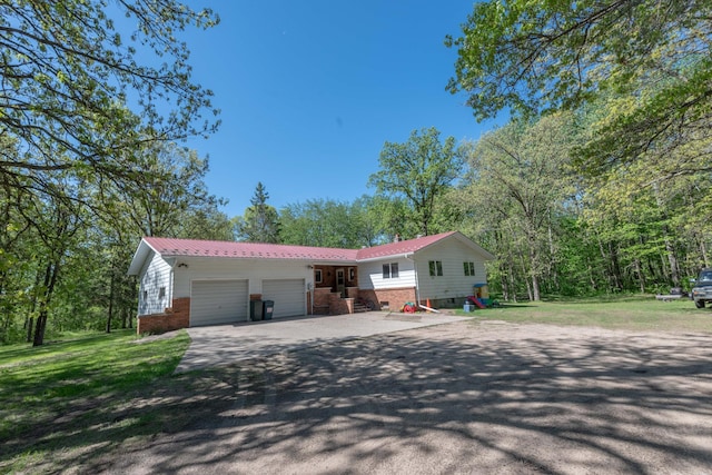 31855 Huntersville Rd, Sebeka, MN 56477 - single story home featuring brick siding, an attached garage, driveway, and metal roof