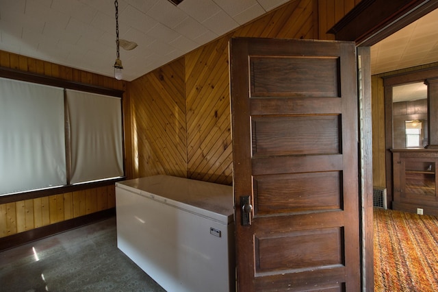 411 6th St, Bird Island, MN 55310 - kitchen featuring wooden walls and white fridge