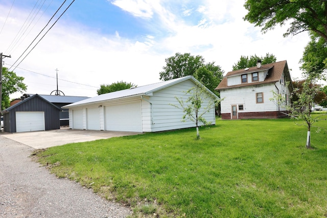 411 6th St, Bird Island, MN 55310 - exterior space with an outbuilding, a garage, and a yard