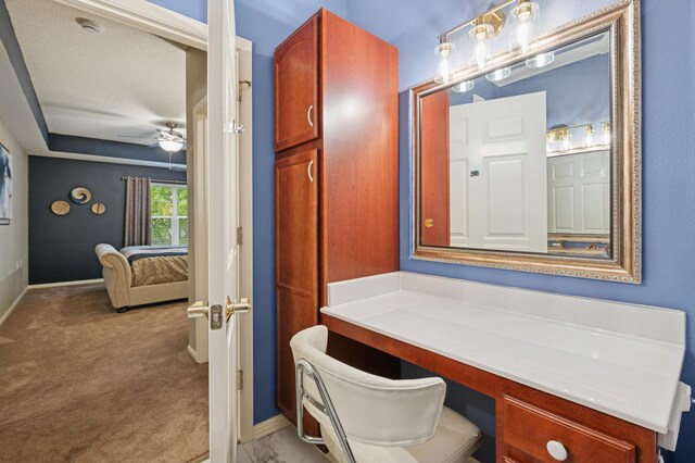 3800 85th Ave N Unit 312, Brooklyn Park, MN 55443 - bathroom featuring ceiling fan, baseboards, and vanity
