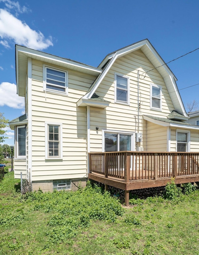1638 Concordia Ave, Saint Paul, MN 55104 - rear view of property with a wooden deck and a gambrel roof