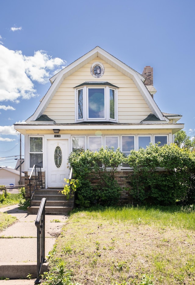 1638 Concordia Ave, Saint Paul, MN 55104 - dutch colonial featuring a chimney and a gambrel roof