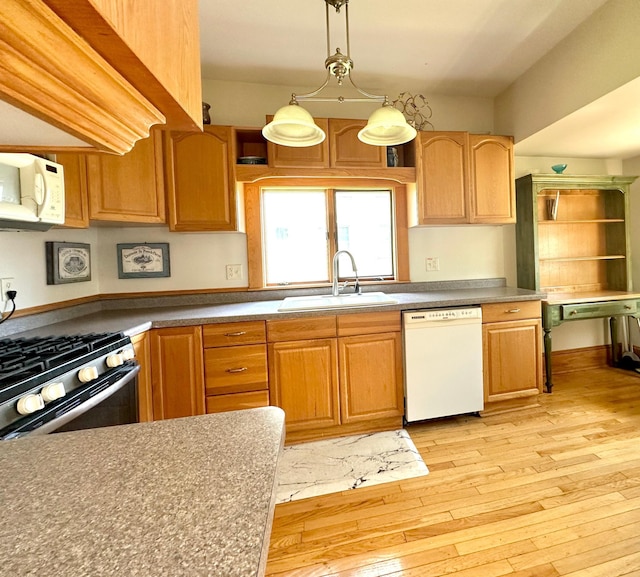 1638 Concordia Ave, Saint Paul, MN 55104 - kitchen with white appliances, a sink, light wood-type flooring, and pendant lighting