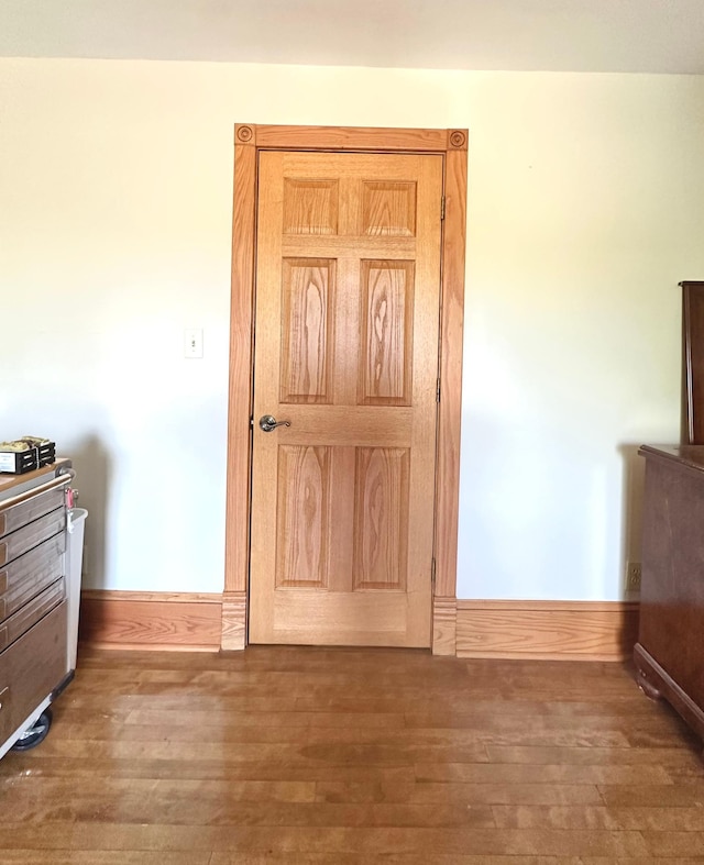 1638 Concordia Ave, Saint Paul, MN 55104 - unfurnished bedroom featuring wood-type flooring and baseboards