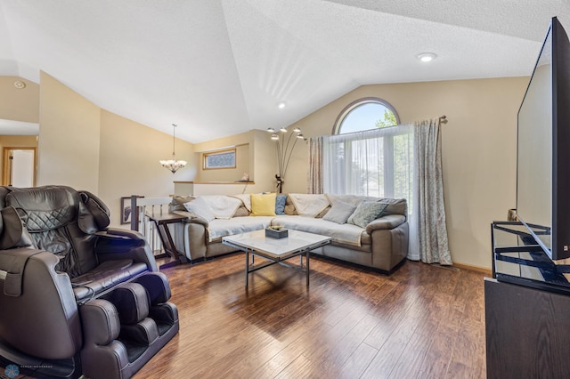3138 25th Ave S, Fargo, ND 58103 - living area with lofted ceiling, a chandelier, dark wood-style flooring, and baseboards