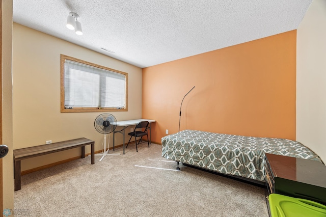 3138 25th Ave S, Fargo, ND 58103 - bedroom with carpet flooring, a textured ceiling, and baseboards
