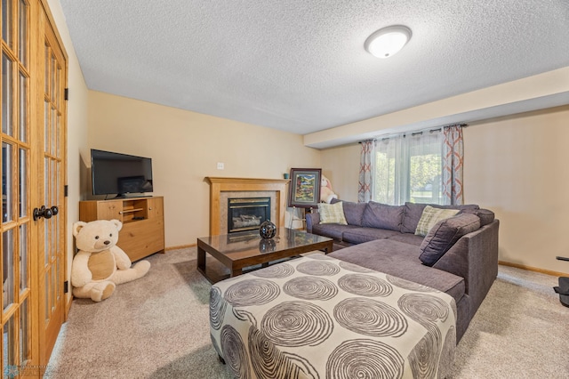 3138 25th Ave S, Fargo, ND 58103 - living area featuring carpet floors, a textured ceiling, a tiled fireplace, and baseboards