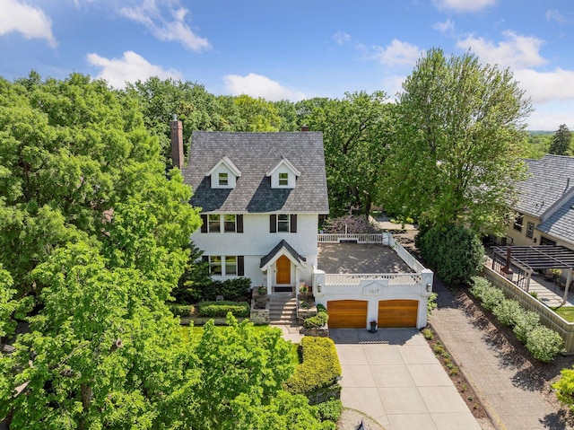 1617 Franklin Ave, Minneapolis, MN 55405 - view of front of home with a garage, driveway, and a chimney