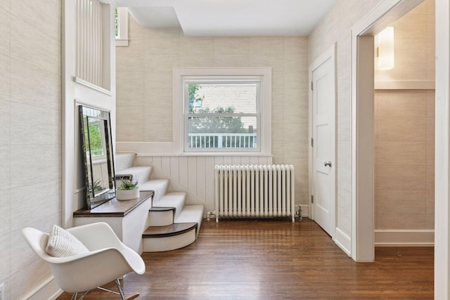 1617 Franklin Ave, Minneapolis, MN 55405 - sitting room featuring radiator, wood finished floors, and stairs