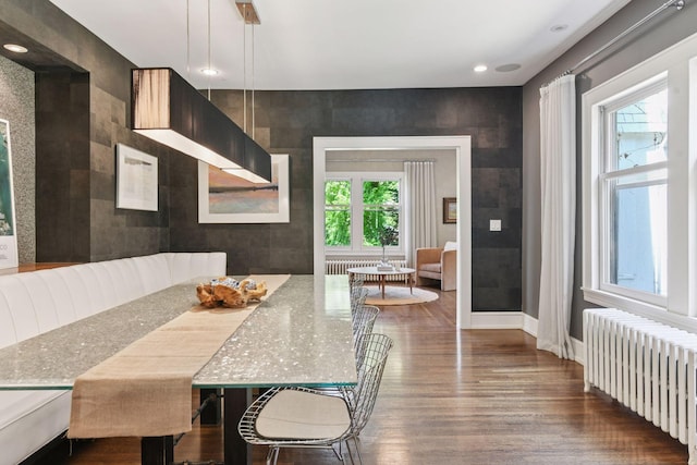1617 Franklin Ave, Minneapolis, MN 55405 - dining room featuring radiator, wood finished floors, recessed lighting, and baseboards