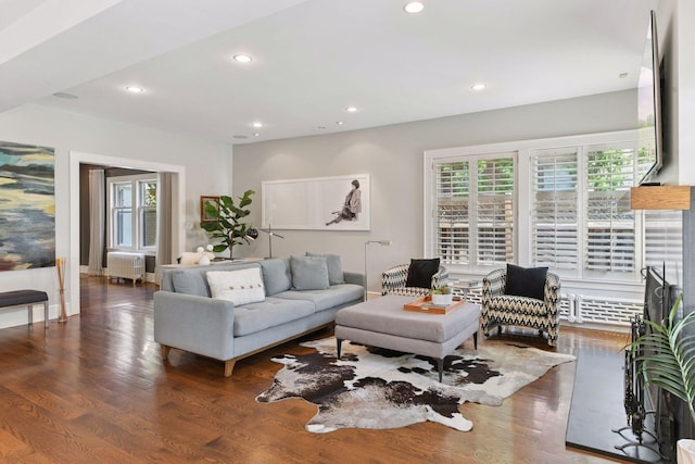 1617 Franklin Ave, Minneapolis, MN 55405 - living room featuring radiator, wood finished floors, recessed lighting, and baseboards